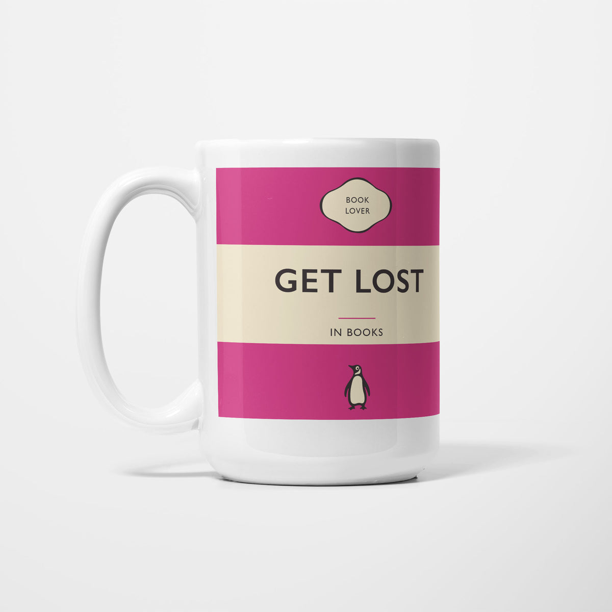 The 15oz Get Lost in Books mug, white ceramic printed as a vintage paperback jacket in magenta and cream, reading 'Get Lost' above 'in Books'