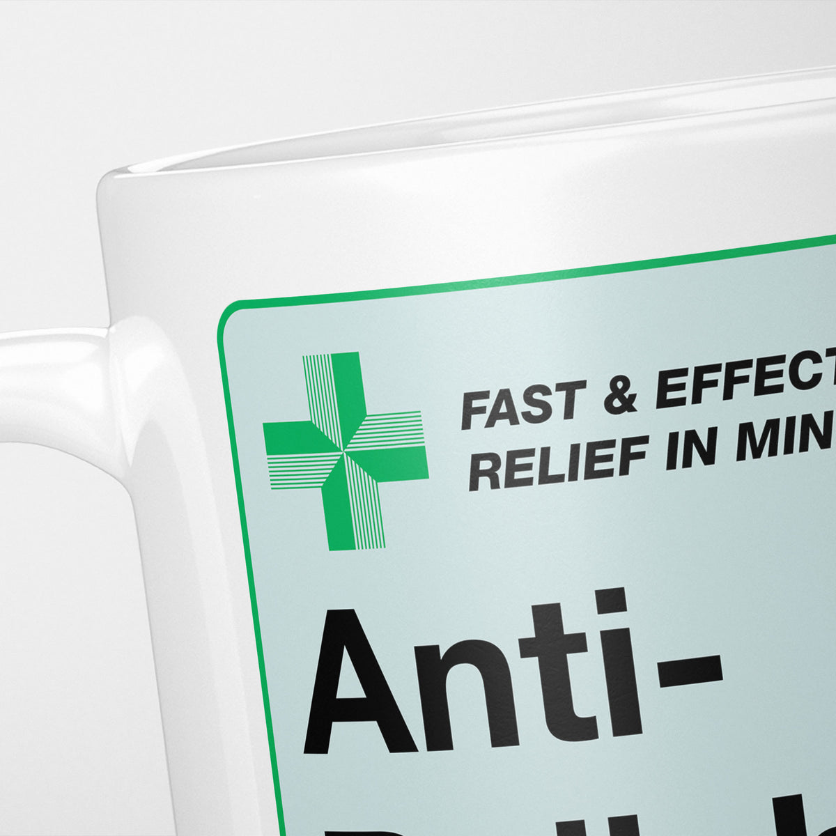 Close crop of the Anti-Bullshit Medication label, the green cross and 'fast and effective relief in minutes' above the name