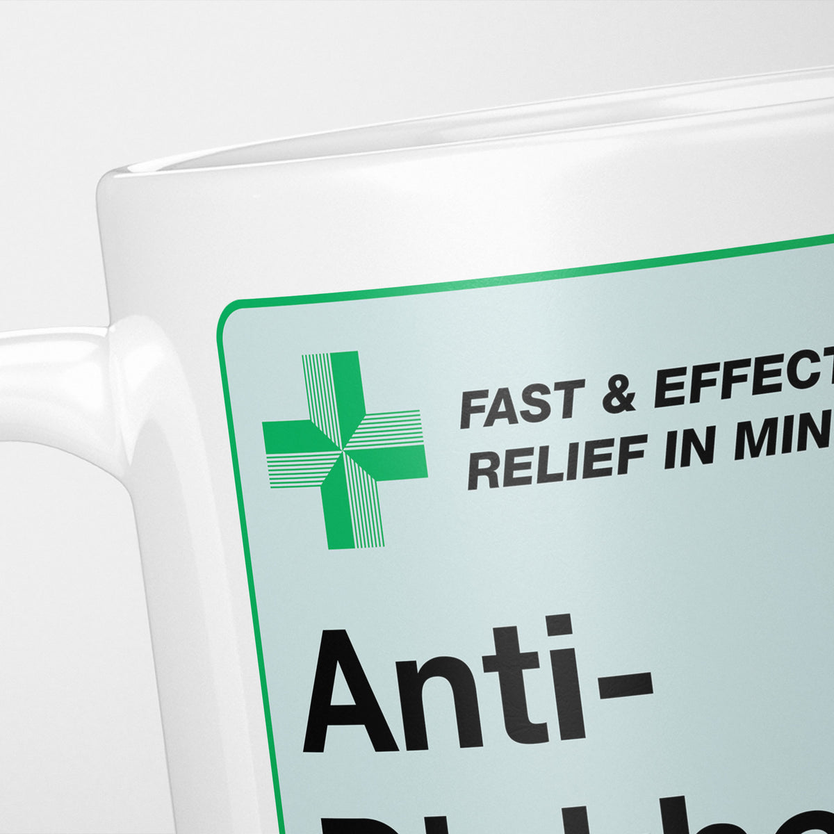 Close crop of the Anti-Dickhead Medication label, the green cross and 'fast and effective relief in minutes' above the name
