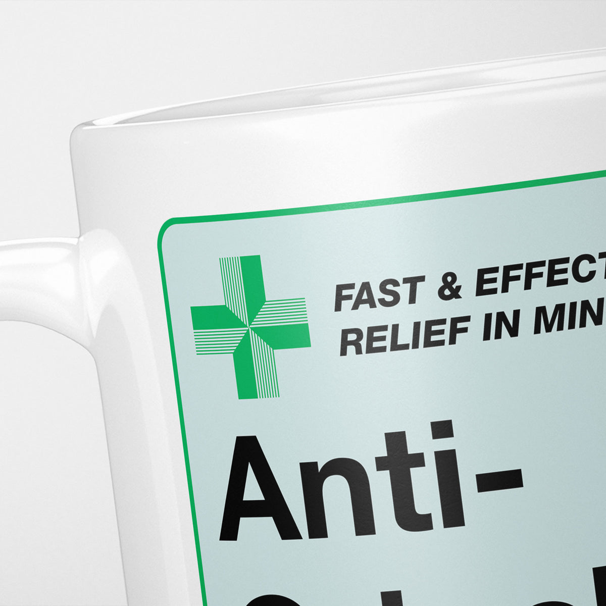 Close crop of the Anti-Grinch Medication label, the green cross and 'fast and effective relief in minutes' above the name