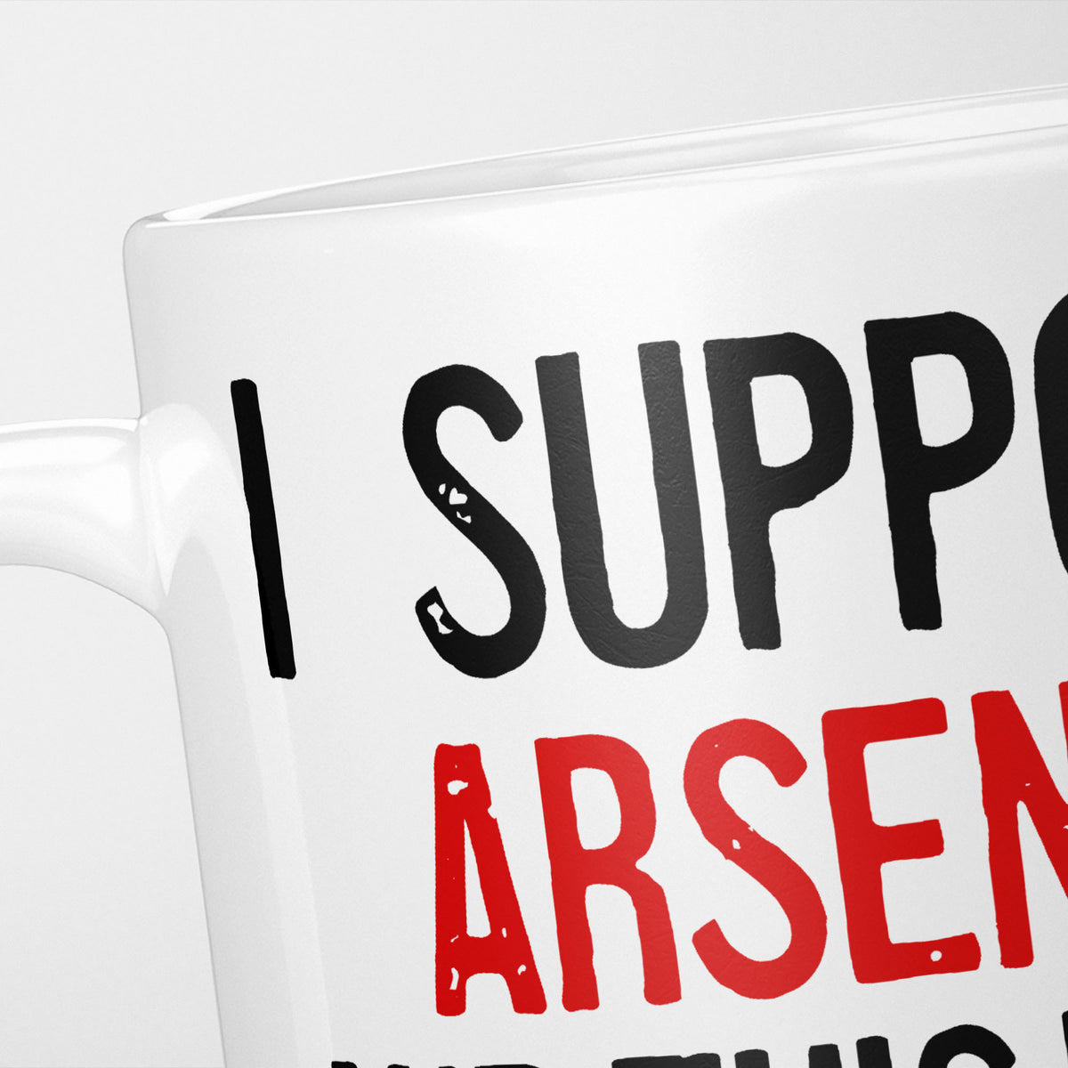 Close crop of the I Support Arsenal mug, 'I Support' in heavy black above the club name in red, running off the edge of the frame