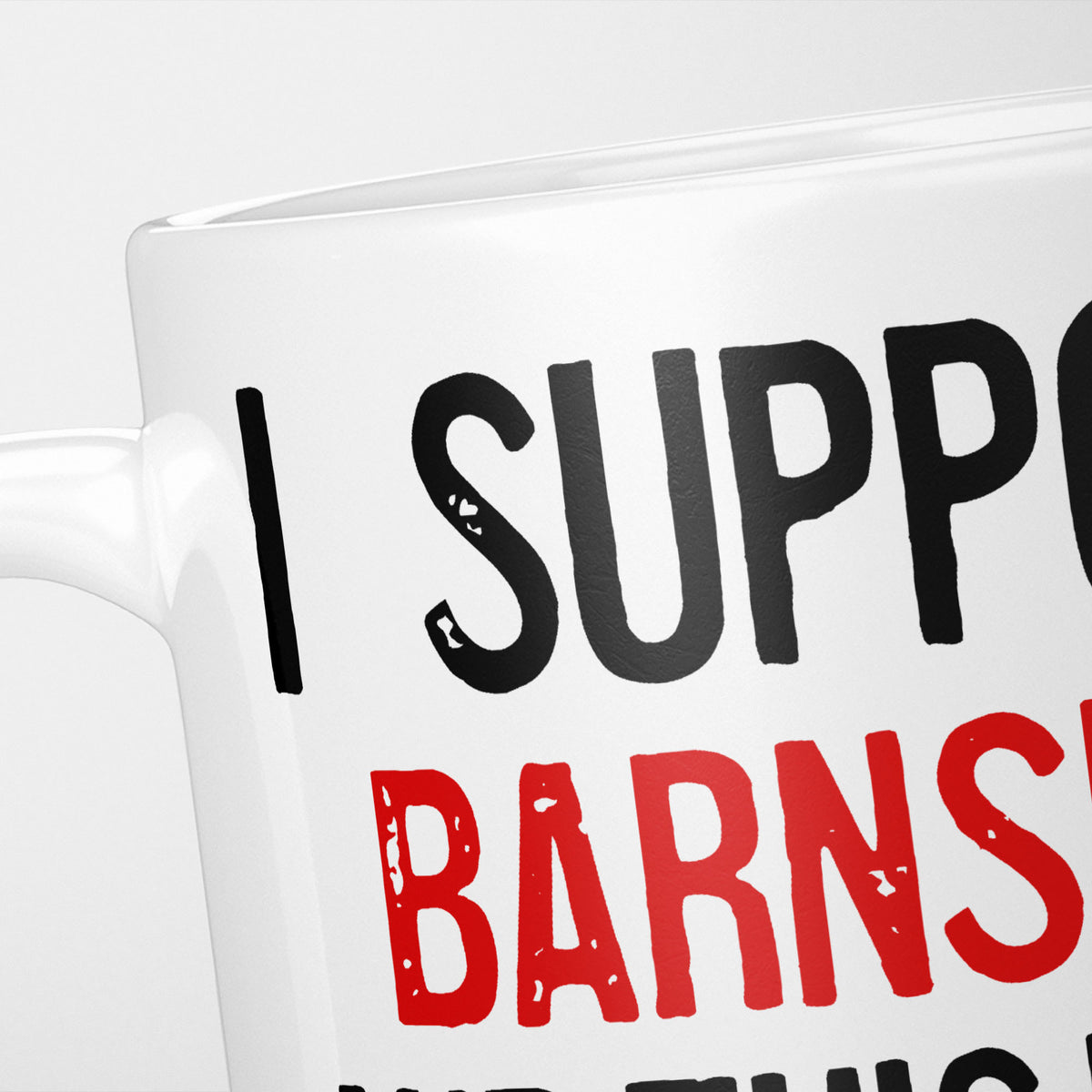 Close crop of the I Support Barnsley mug, 'I Support' in heavy black above the club name in red, running off the edge of the frame