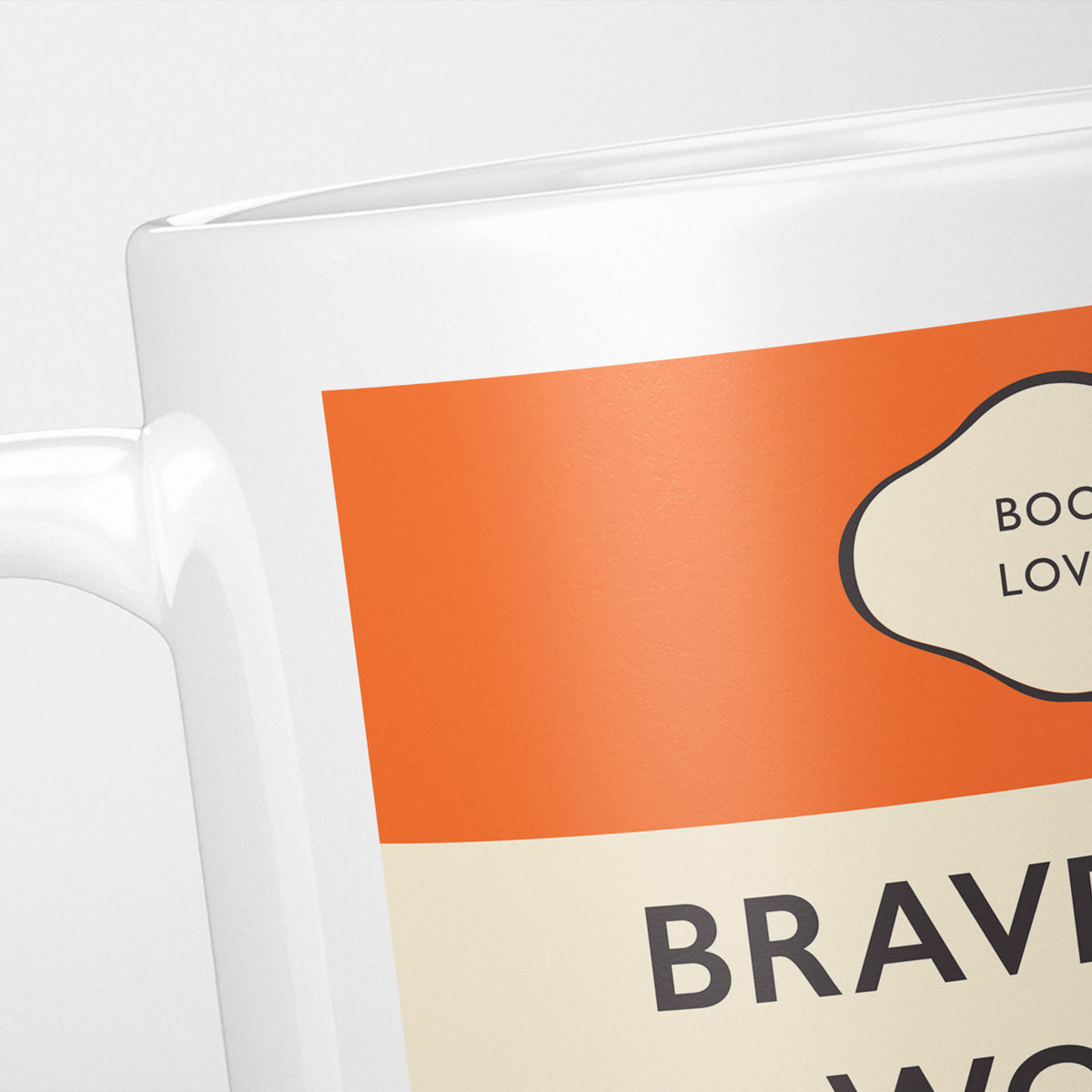 Close crop of the Brave New World jacket, the orange band above the cream title panel, the lettering running off the frame