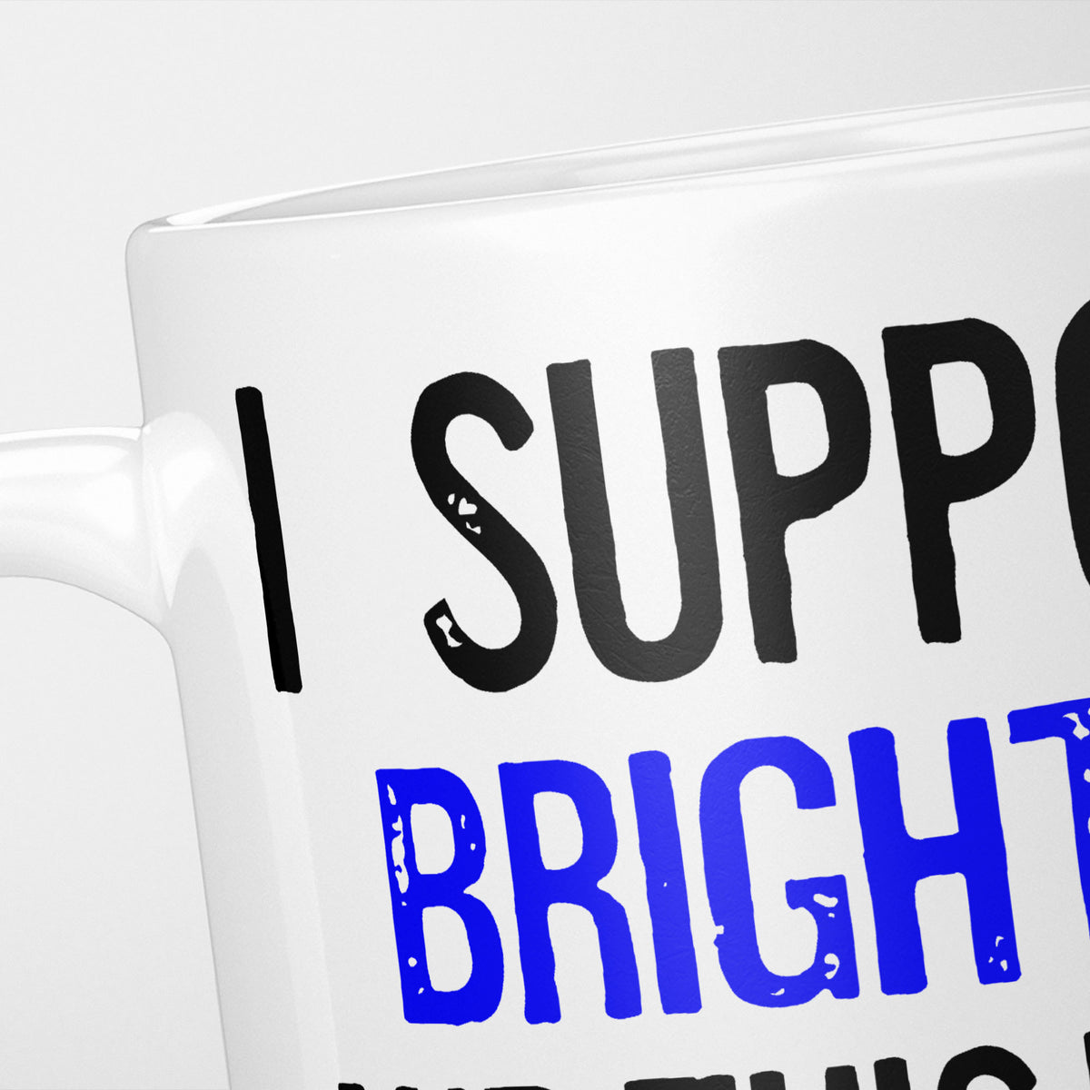 Close crop of the I Support Brighton mug, 'I Support' in heavy black above the club name in blue, running off the edge of the frame