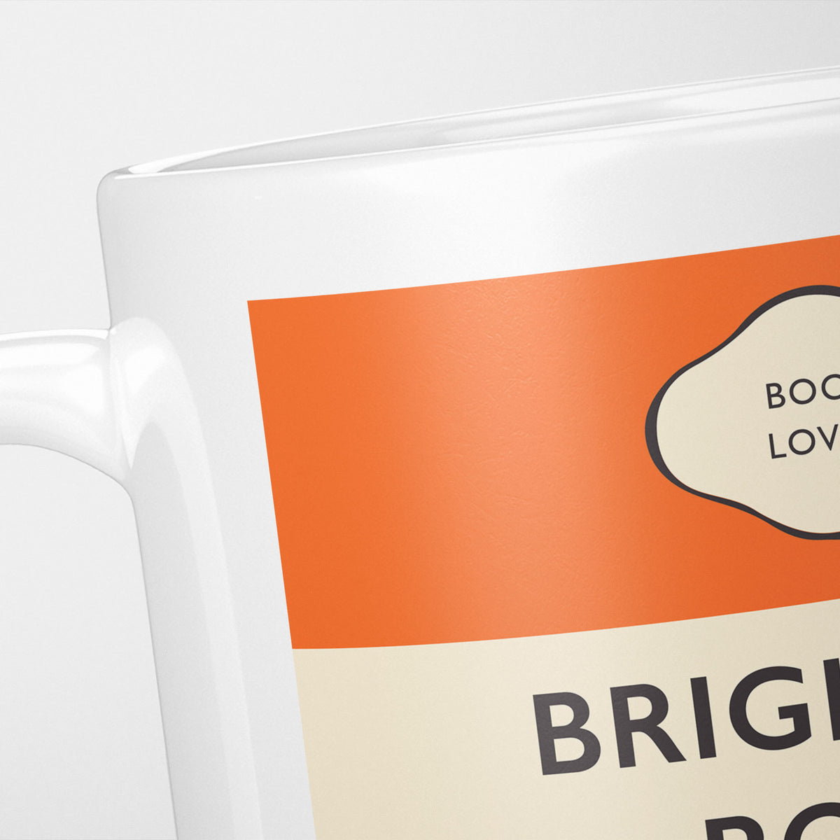 Close crop of the Brighton Rock jacket, the orange band above the cream title panel, the lettering running off the frame