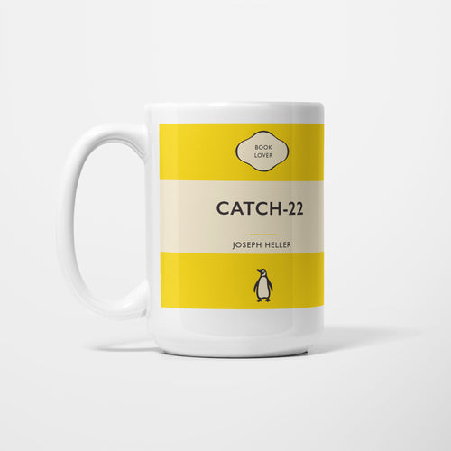 The 15oz Catch 22 mug, white ceramic printed as a vintage paperback jacket in yellow and cream, reading 'Catch-22' above Joseph Heller
