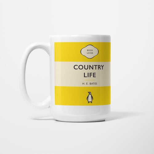 The 15oz Country Life mug, white ceramic printed as a vintage paperback jacket in yellow and cream, reading 'Country Life' above H. E. Bates
