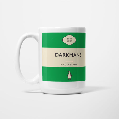 The 15oz Darkmans mug, white ceramic printed as a vintage paperback jacket in green and cream, reading 'Darkmans' above Nicola Barker