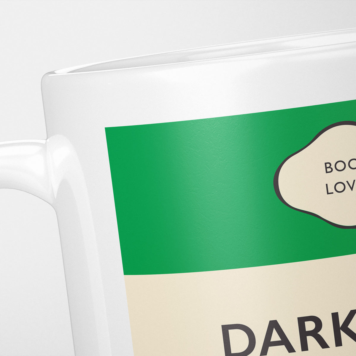 Close crop of the Darkmans jacket, the green band above the cream title panel, the lettering running off the frame