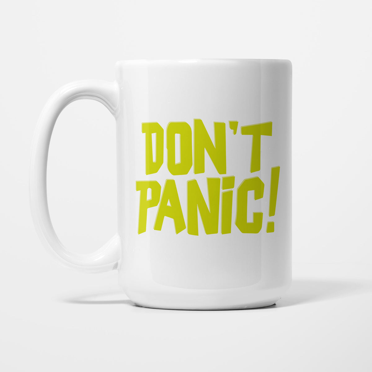 The 15oz Don't Panic! mug, white ceramic with the words 'Don't Panic!' in large bold yellow-green lettering