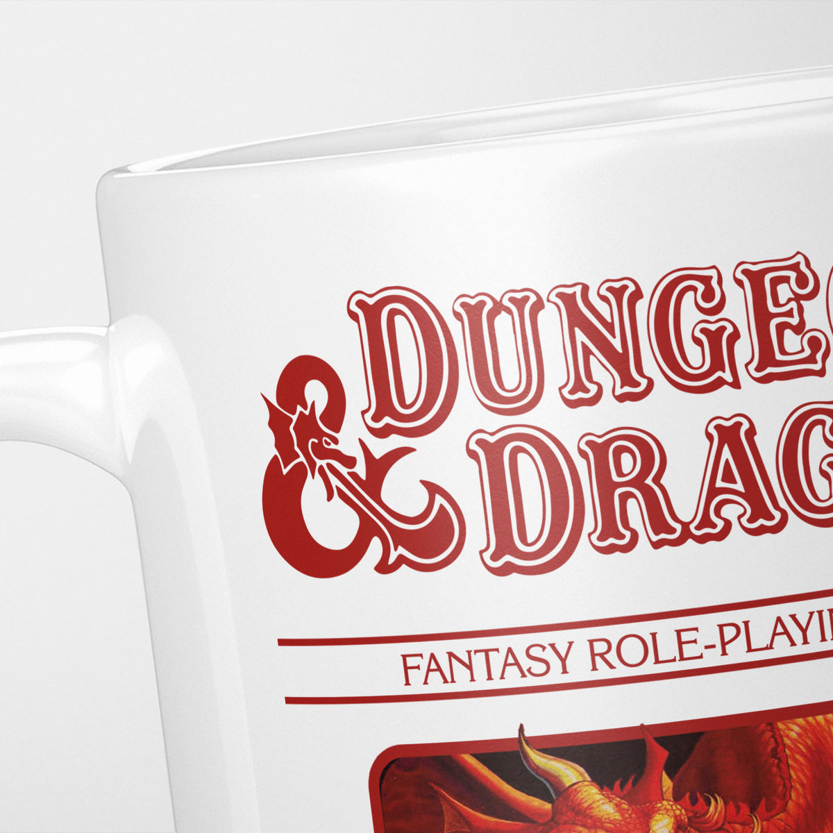Close crop of the Dungeons & Dragons Red Box mug, the ornate logo and 'fantasy role-playing game' above the box artwork