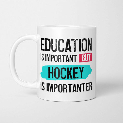 White ceramic mug with bold colourful text reading 'Education is Important but Hockey is Importanter'