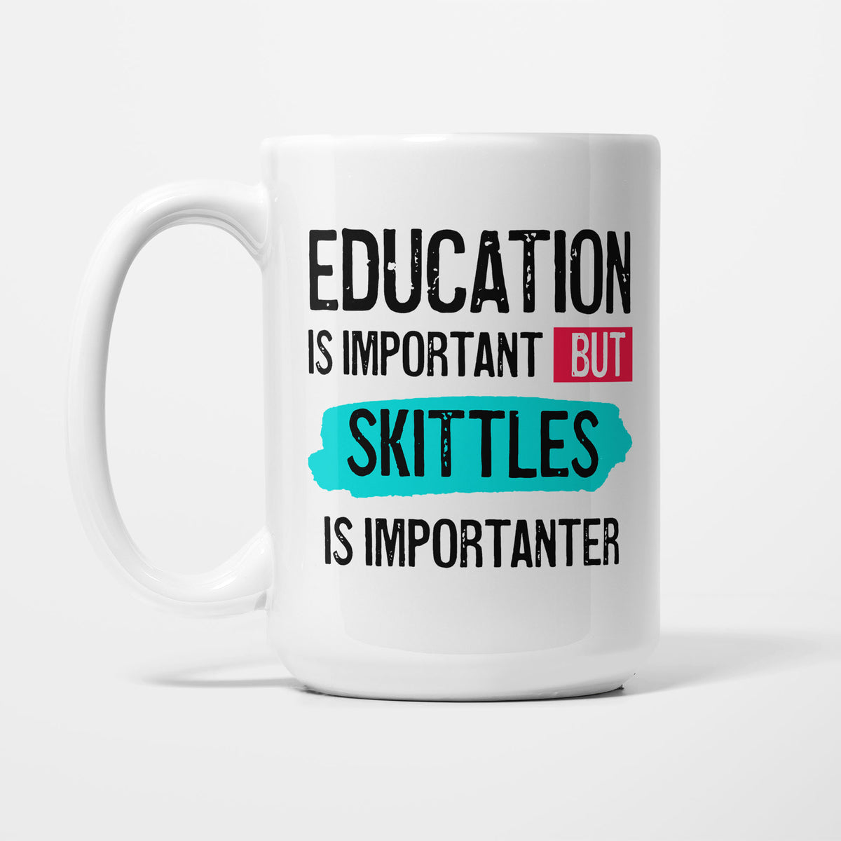 Education is Important but Skittles is Importanter printed on a white 15oz/425ml mug
