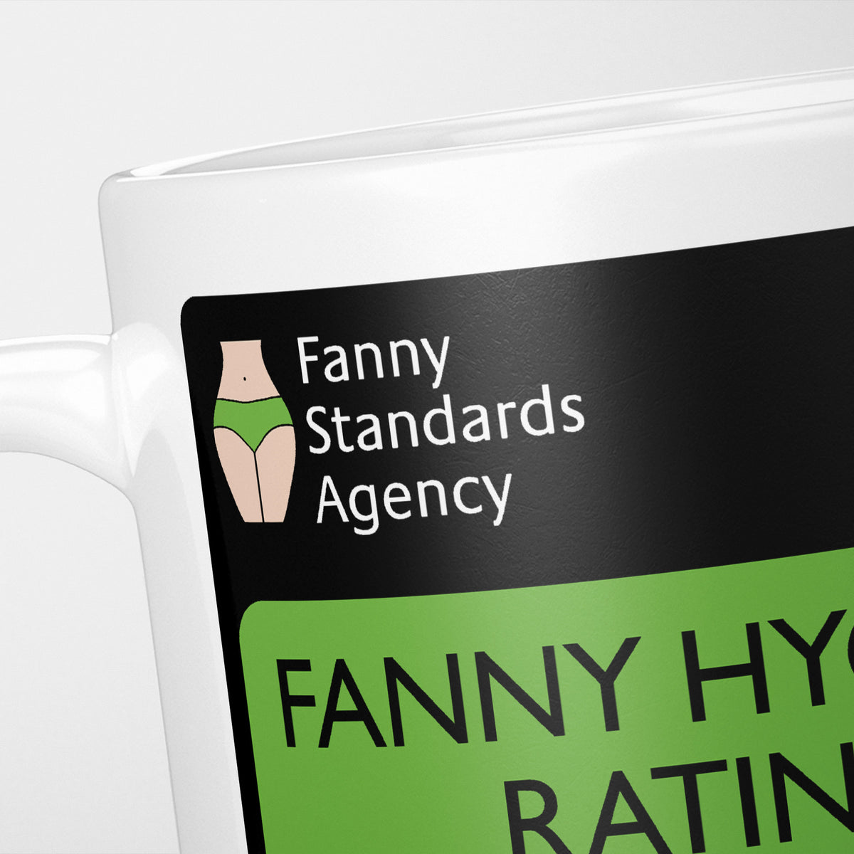 Close crop of the Fanny Hygiene Rating mug: the Fanny Standards Agency logo and the top of the rating sign
