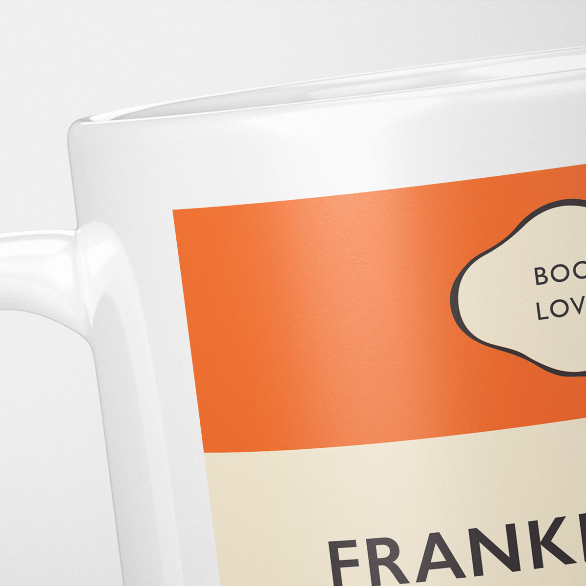 Close crop of the Frankenstein jacket, the orange band above the cream title panel, the lettering running off the frame