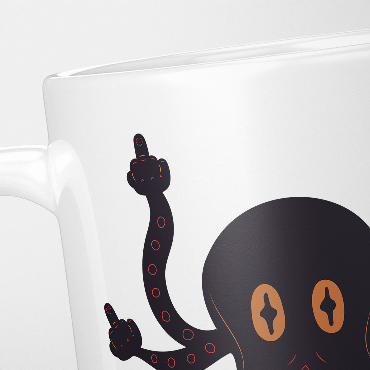 Close crop of the F*cktopus mug, the black octopus with orange eyes and a raised tentacle