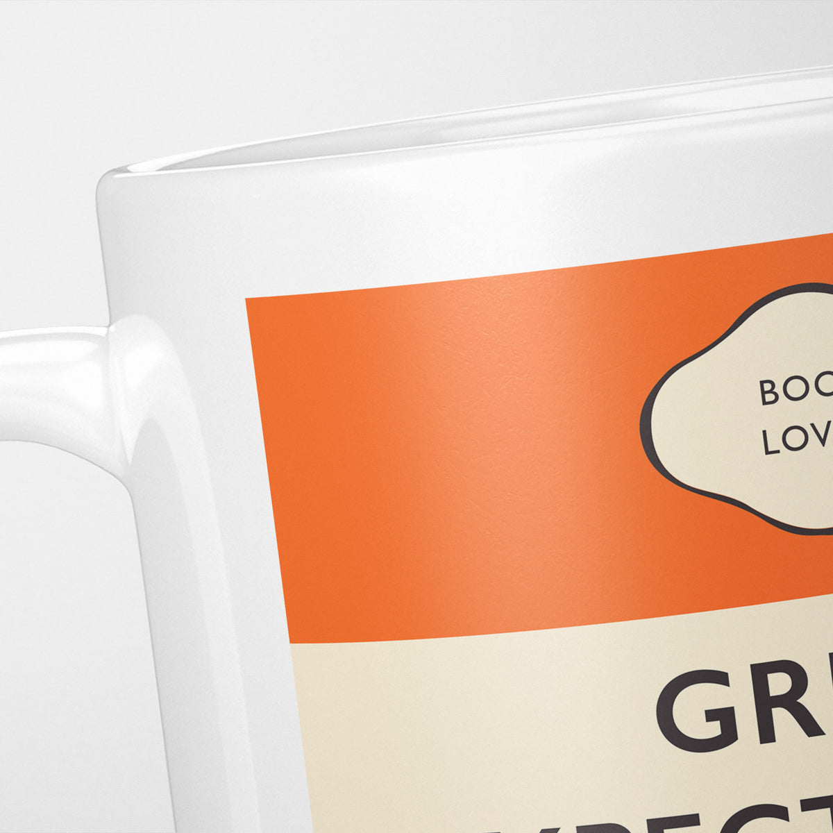 Close crop of the Great Expectations jacket, the orange band above the cream title panel, the lettering running off the frame