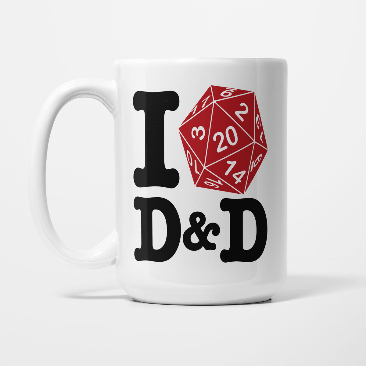 The 15oz I D&D mug, white ceramic reading 'I D&D' in bold black type, with a red twenty-sided die in place of the heart