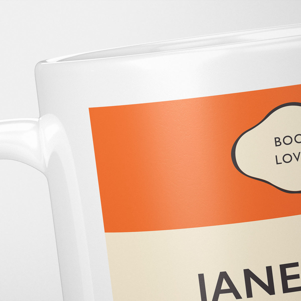 Close crop of the Jane Eyre jacket, the orange band above the cream title panel, the lettering running off the frame