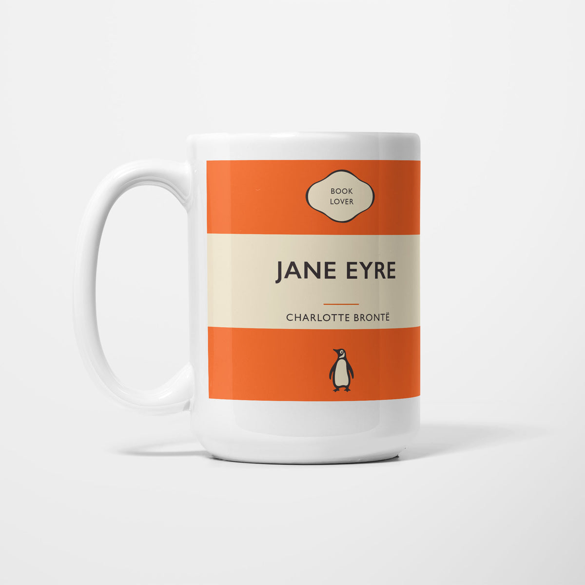The 15oz Jane Eyre mug, white ceramic printed as a vintage paperback jacket in orange and cream, reading 'Jane Eyre' above Charlotte Bronte