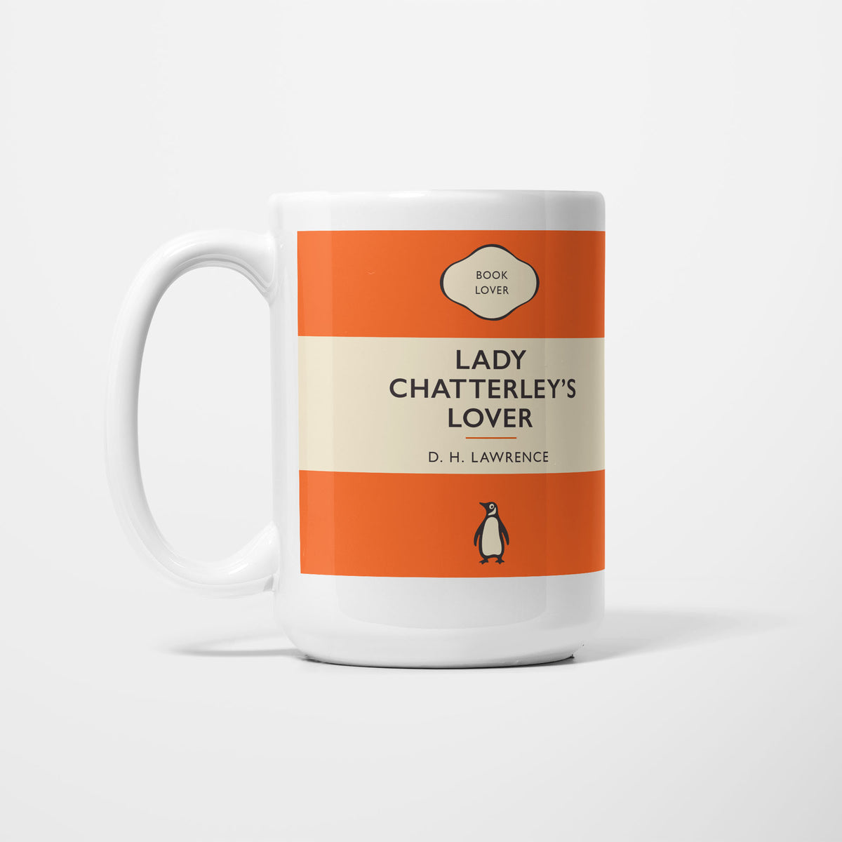 The 15oz Lady Chatterley's Lover mug, white ceramic printed as a vintage paperback jacket in orange and cream, reading 'Lady Chatterley's Lover' above D. H. Lawrence