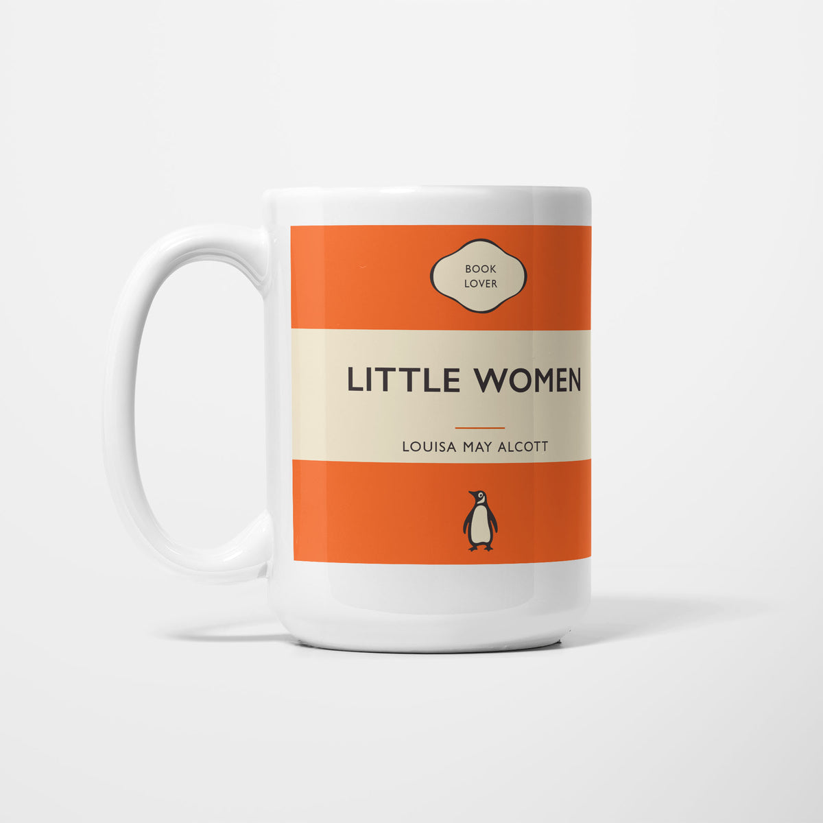 The 15oz Little Women mug, white ceramic printed as a vintage paperback jacket in orange and cream, reading 'Little Women' above Louisa May Alcott