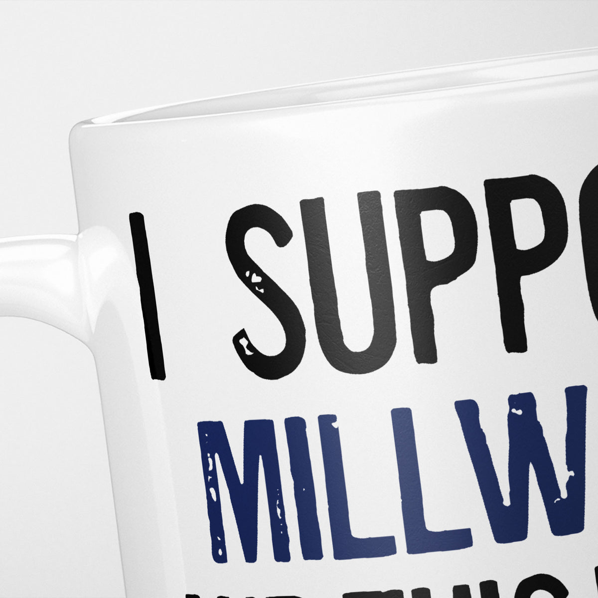 Close crop of the I Support Millwall mug, 'I Support' in heavy black above the club name in navy, running off the edge of the frame