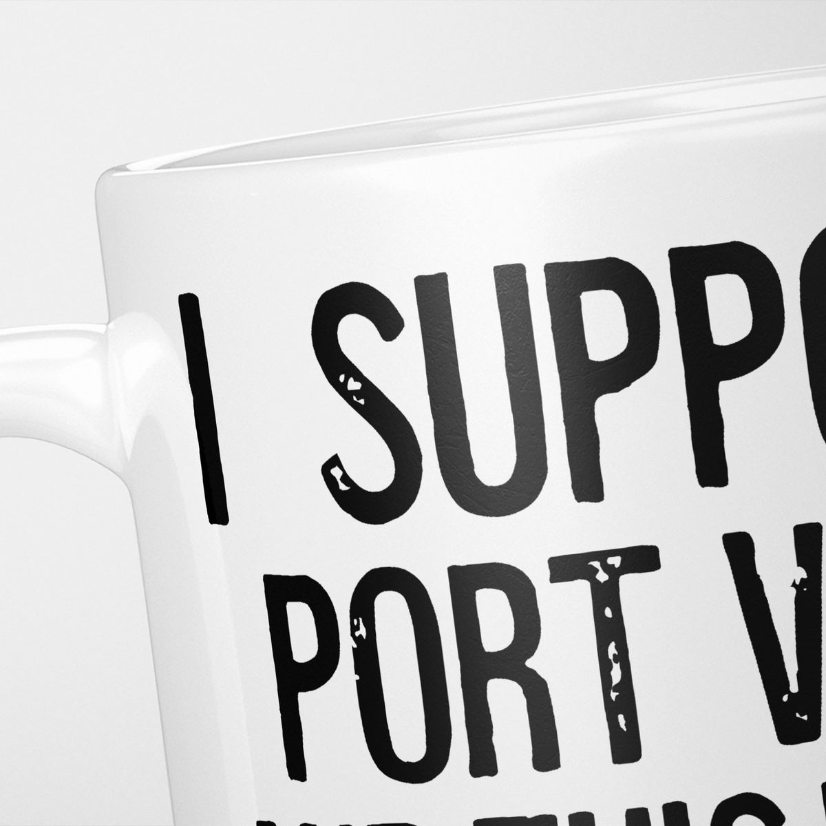 Close crop of the I Support Port Vale mug, 'I Support' above the club name in heavy black type, running off the edge of the frame