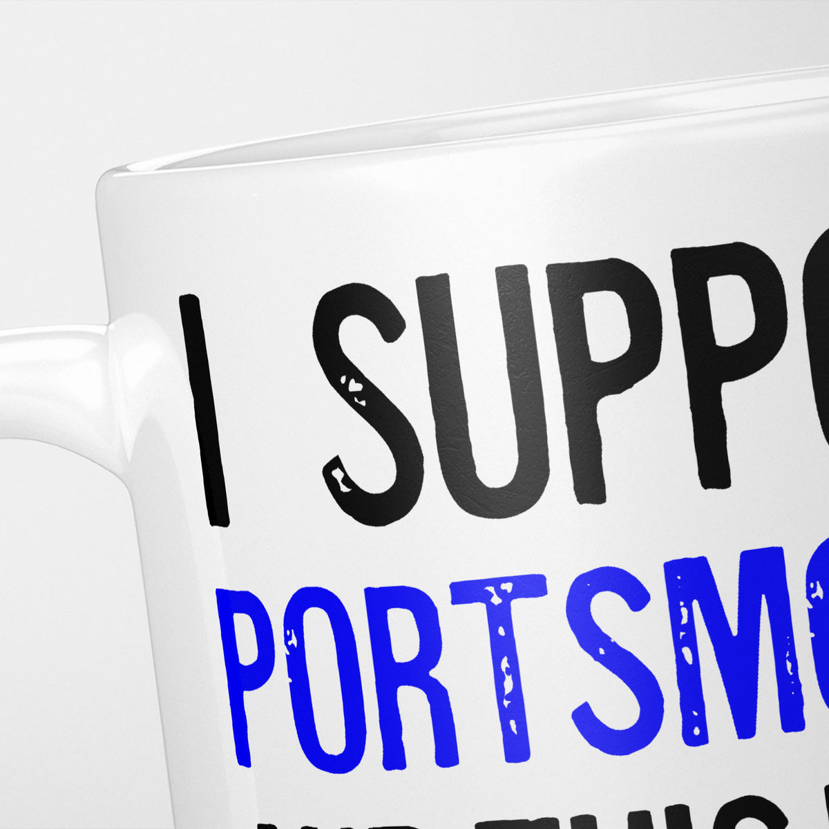 Close crop of the I Support Portsmouth mug, 'I Support' in heavy black above the club name in blue, running off the edge of the frame
