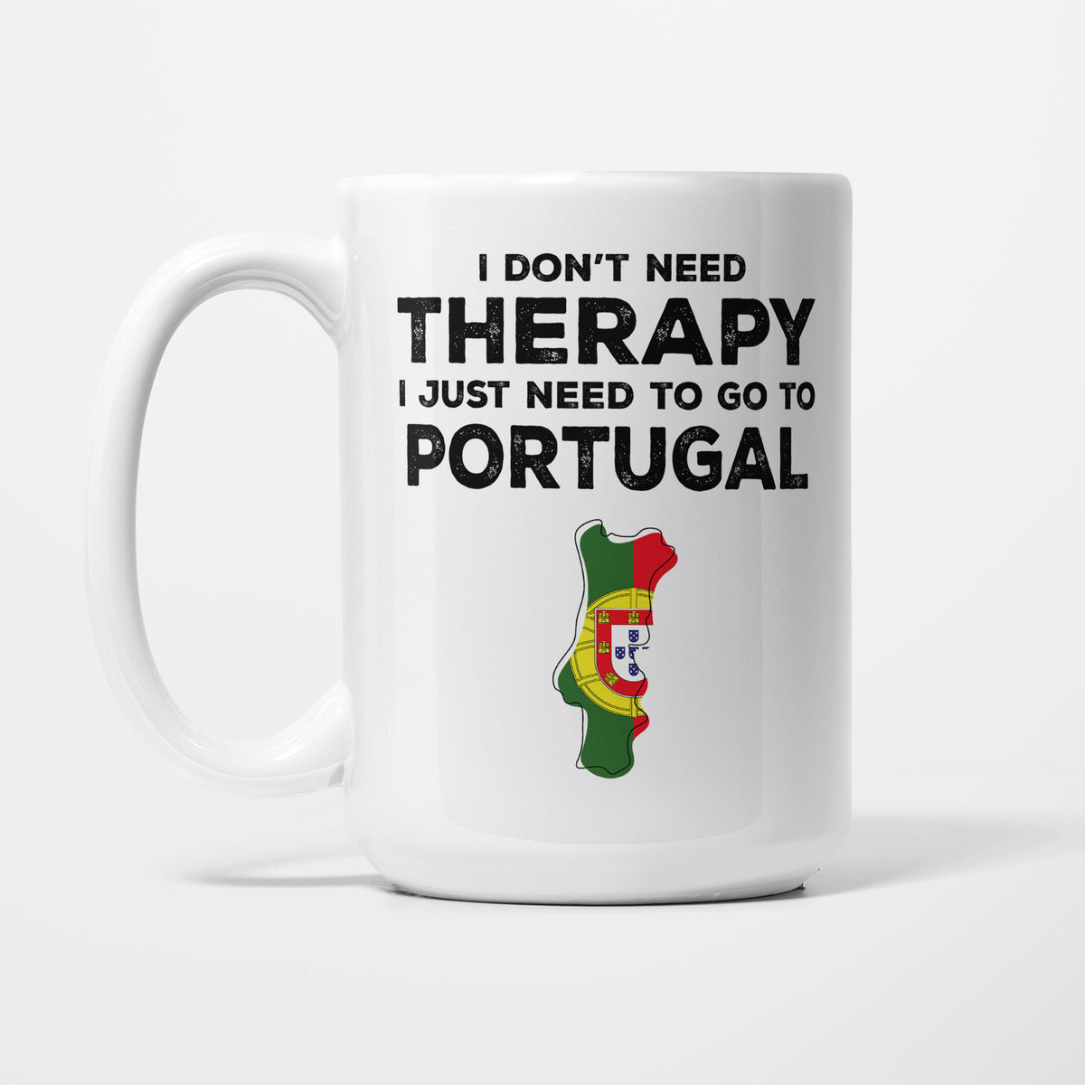 The 15oz I Need Portugal mug, white ceramic in bold black type reading 'I don't need therapy, I just need to go to PORTUGAL', above an outline of Portugal filled with its national flag