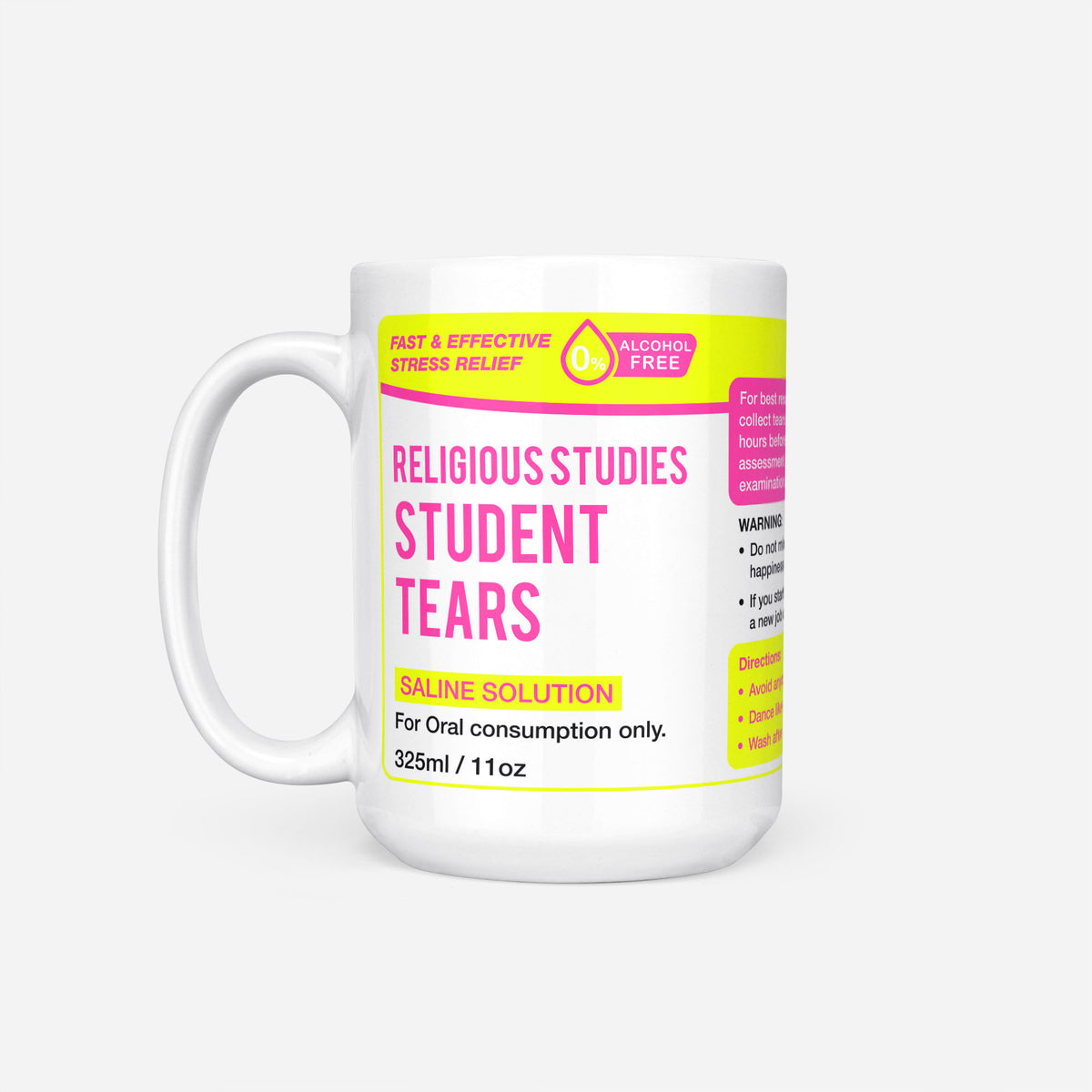 The 15oz Religious Studies Student Tears mug, white ceramic with a yellow pharmacy-style label reading 'Religious Studies Student Tears — Saline Solution, for oral consumption only'