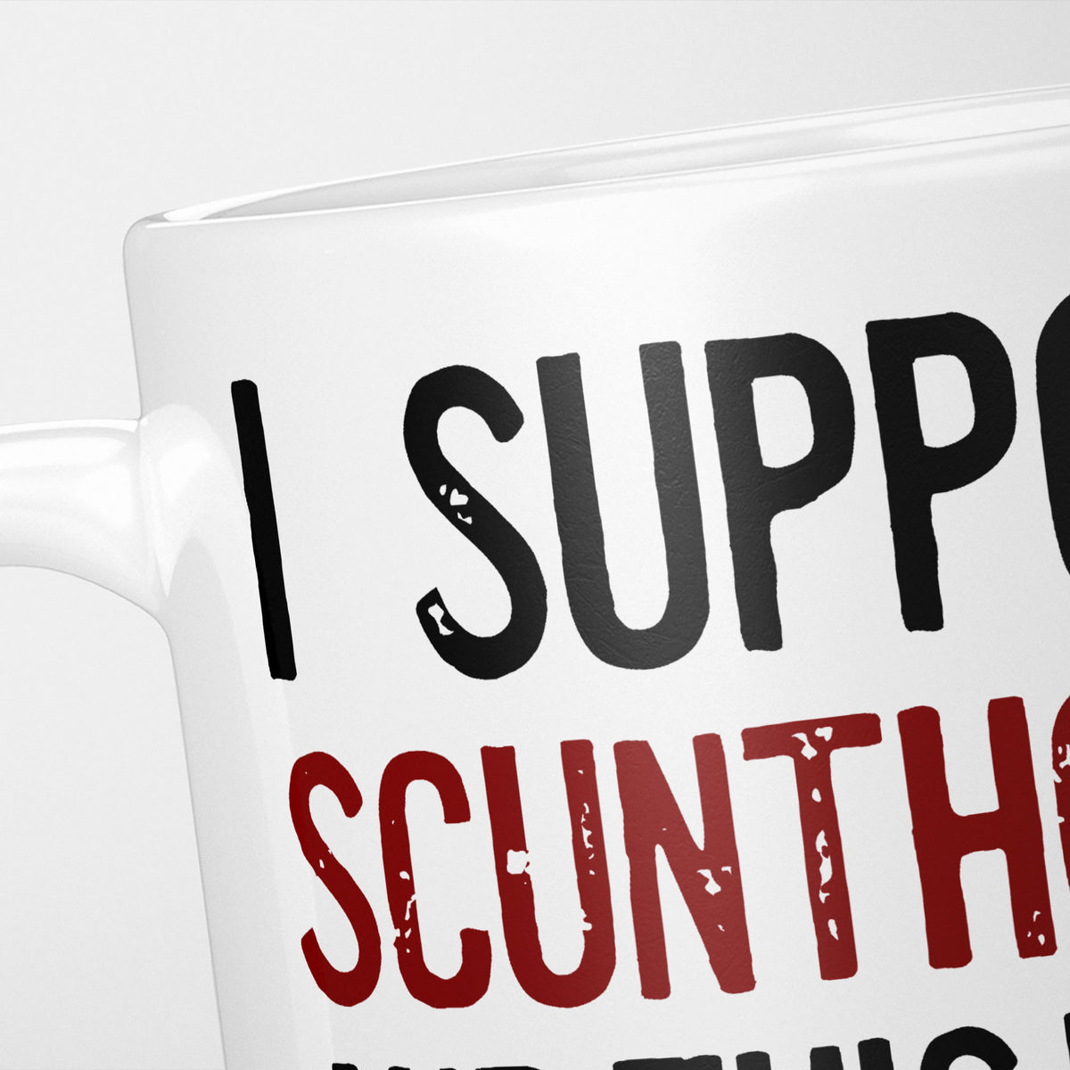 Close crop of the I Support Scunthorpe mug, 'I Support' in heavy black above the club name in claret, running off the edge of the frame