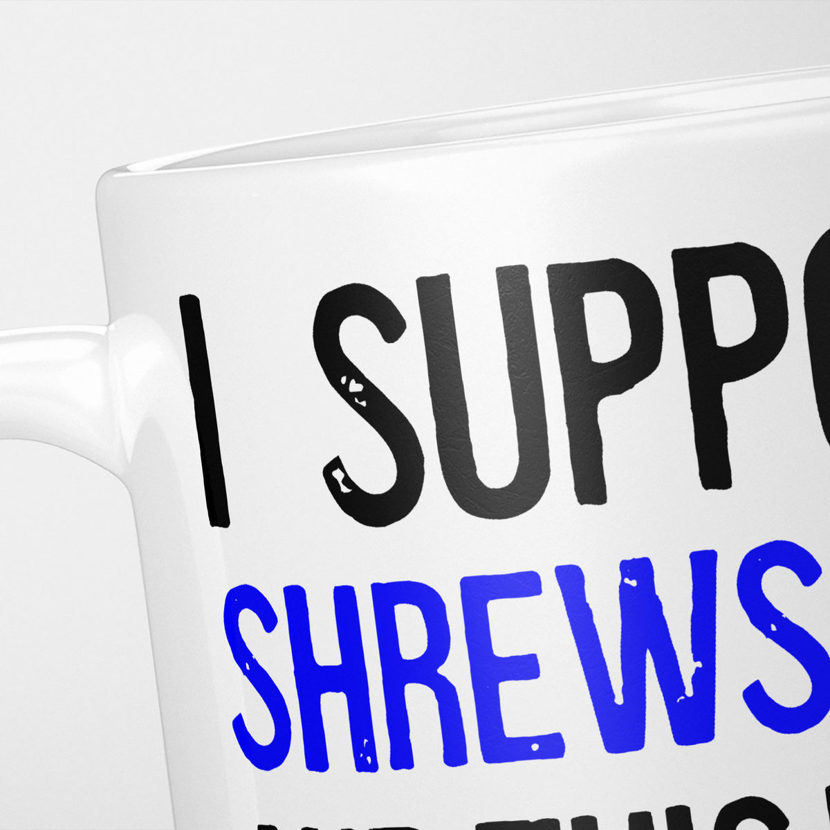 Close crop of the I Support Shrewsbury mug, 'I Support' in heavy black above the club name in blue, running off the edge of the frame