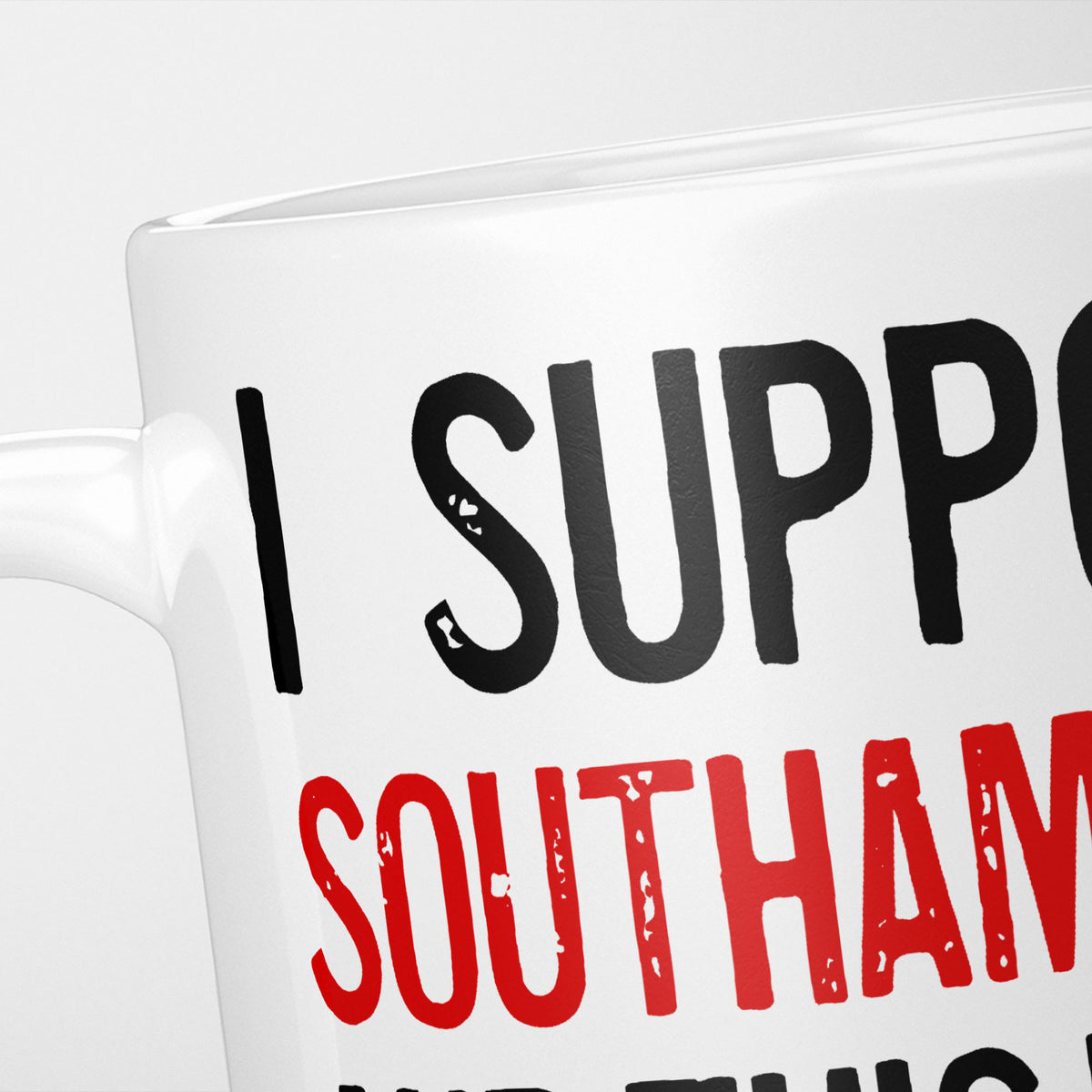 Close crop of the I Support Southampton mug, 'I Support' in heavy black above the club name in red, running off the edge of the frame