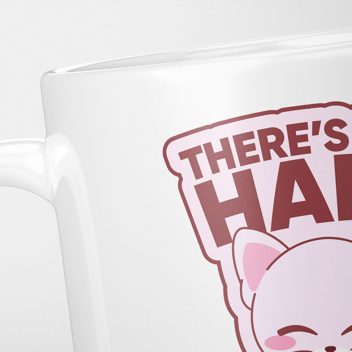 Close crop of the Sphynx Cat mug, the pink cat's ears above 'There's… hai…'