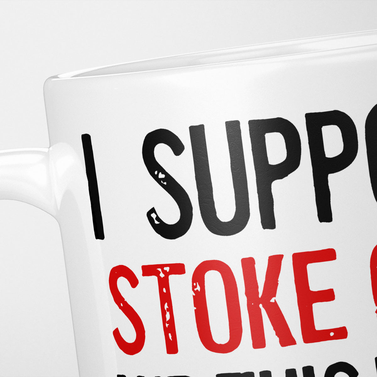Close crop of the I Support Stoke City mug, 'I Support' in heavy black above the club name in red, running off the edge of the frame