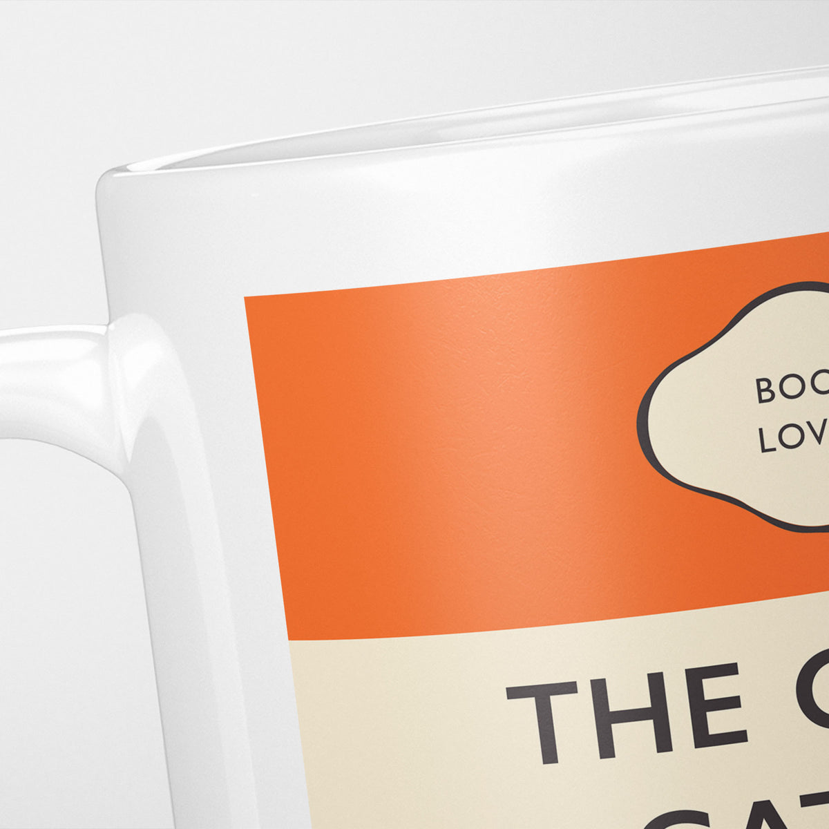 Close crop of the Great Gatsby jacket, the orange band above the cream title panel, the lettering running off the frame