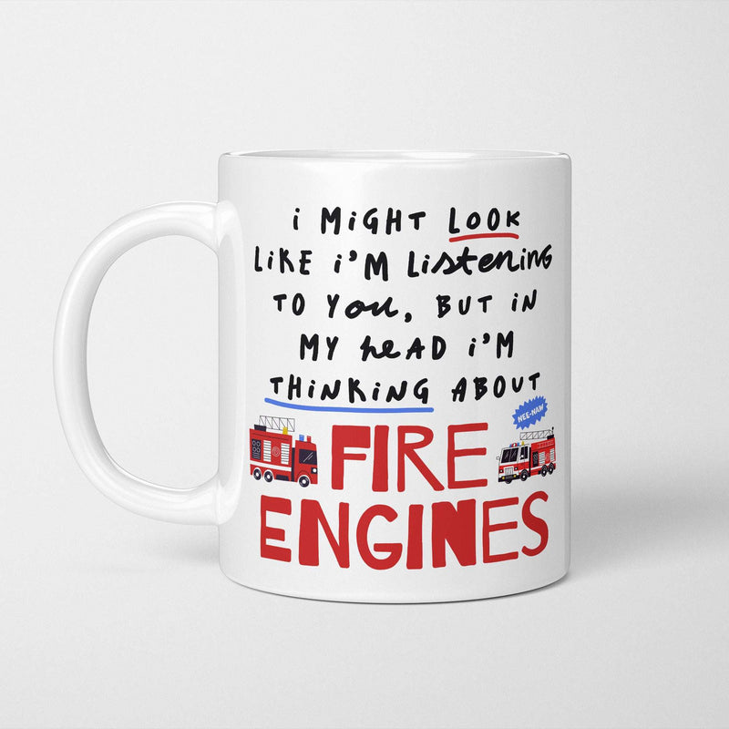 White ceramic mug with red and black graphic text reading 'In My Head I'm Thinking About Fire Engines'