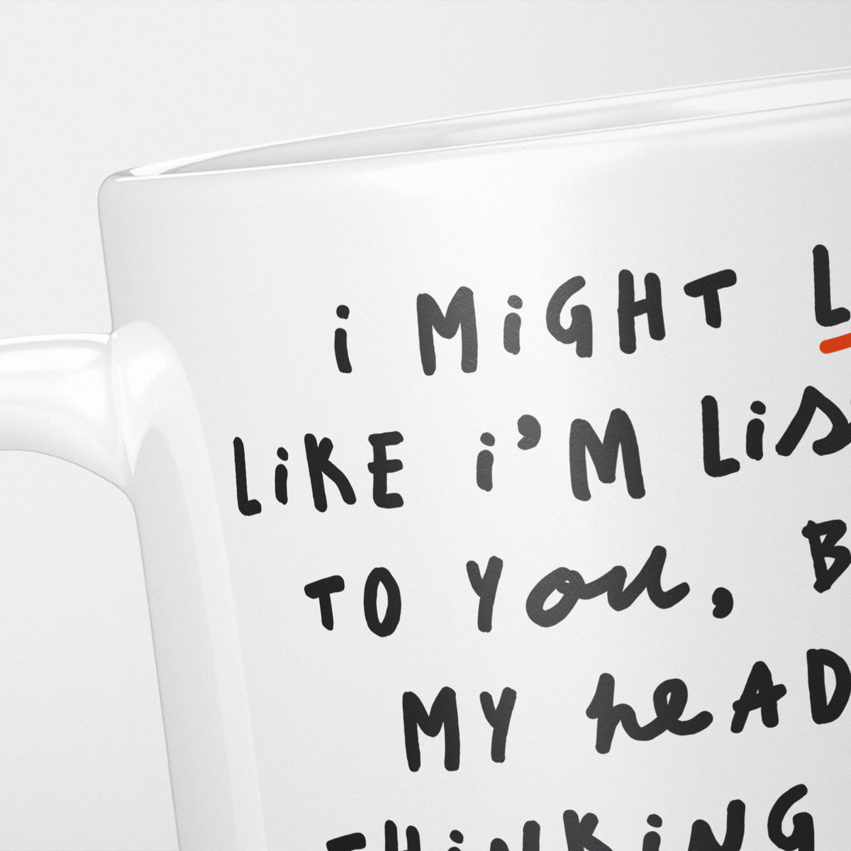 Close crop of the I'm Thinking About Chickens mug, the opening of the hand-lettered text running off the frame, underlined in orange