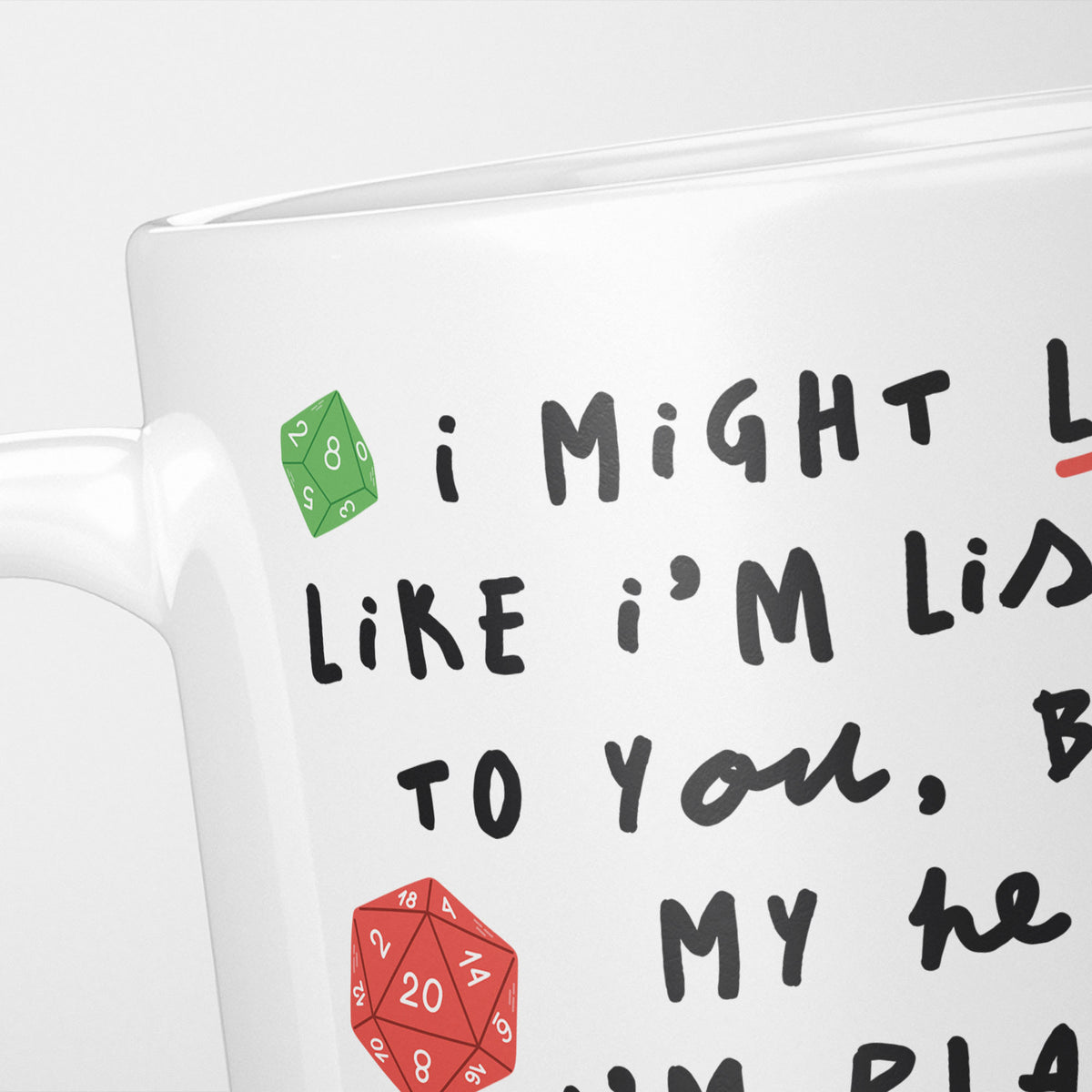 Close crop of the I'm Playing Dungeons & Dragons mug, handwritten doodle lettering beside a red twenty-sided die