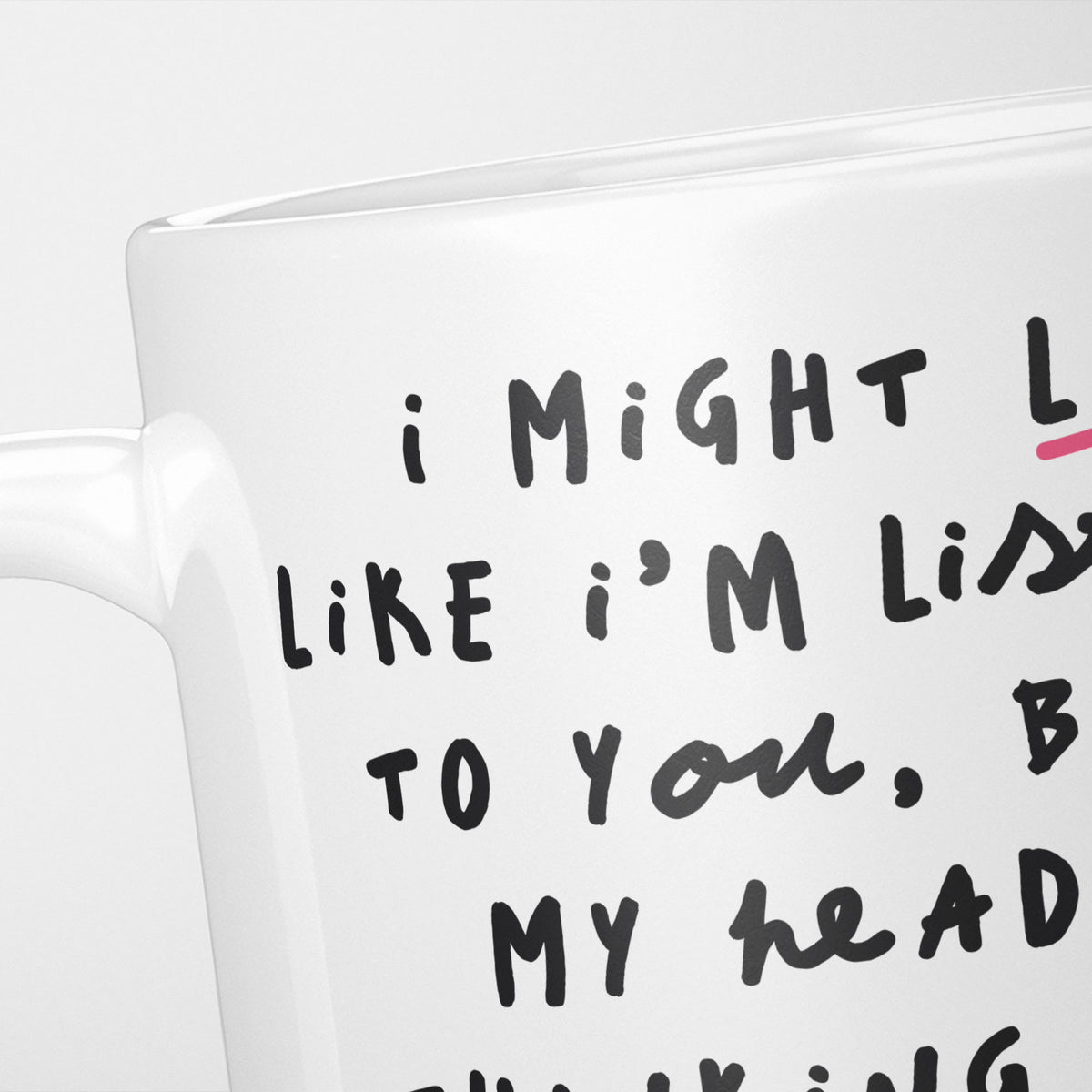 Close crop of the I'm Thinking About Line Dancing mug, the opening of the hand-lettered text running off the frame, underlined in pink