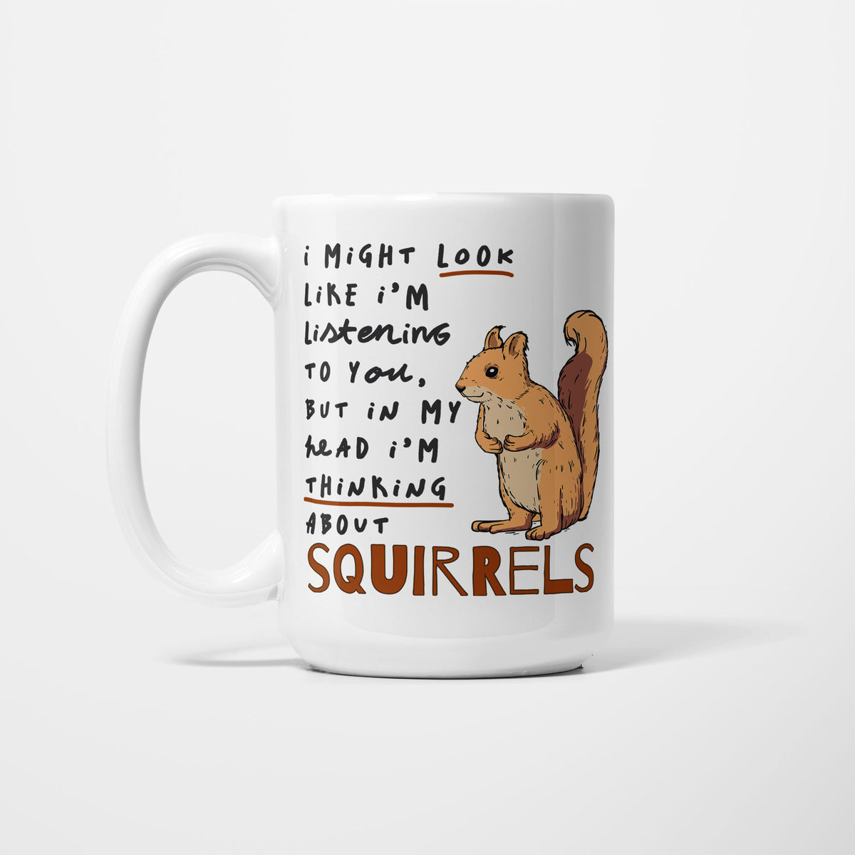 White 15oz ceramic mug, hand-lettered "I might look like I'm listening to you, but in my head I'm thinking about Squirrels" in brown and orange, illustrated with a detailed red squirrel