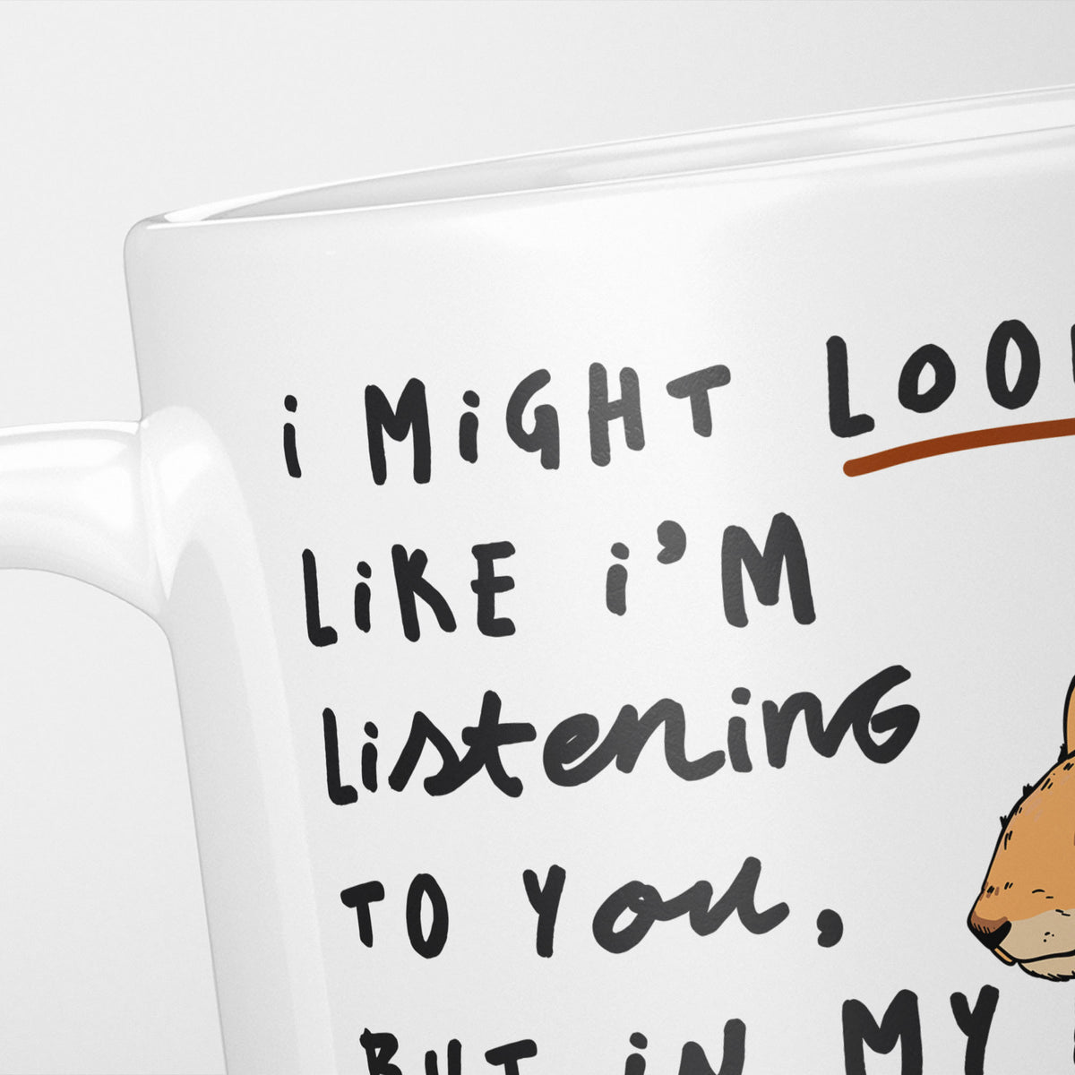 Close crop of the I'm Thinking About Squirrels mug, the opening of the hand-lettered text underlined in brown, the red squirrel just entering the frame