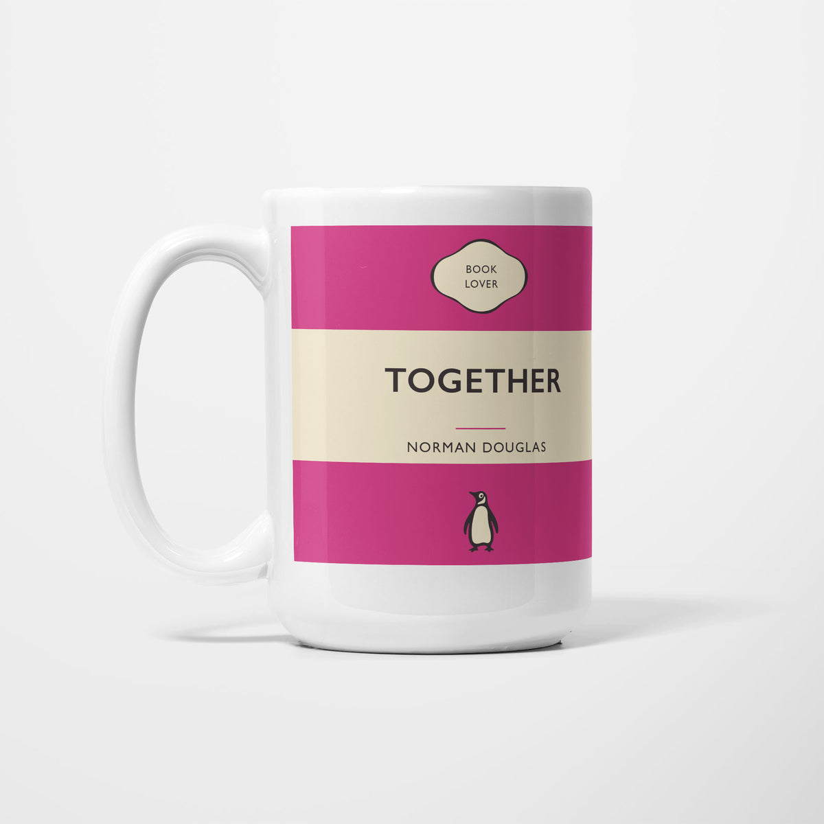 The 15oz Together mug, white ceramic printed as a vintage paperback jacket in magenta and cream, reading 'Together' above Norman Douglas