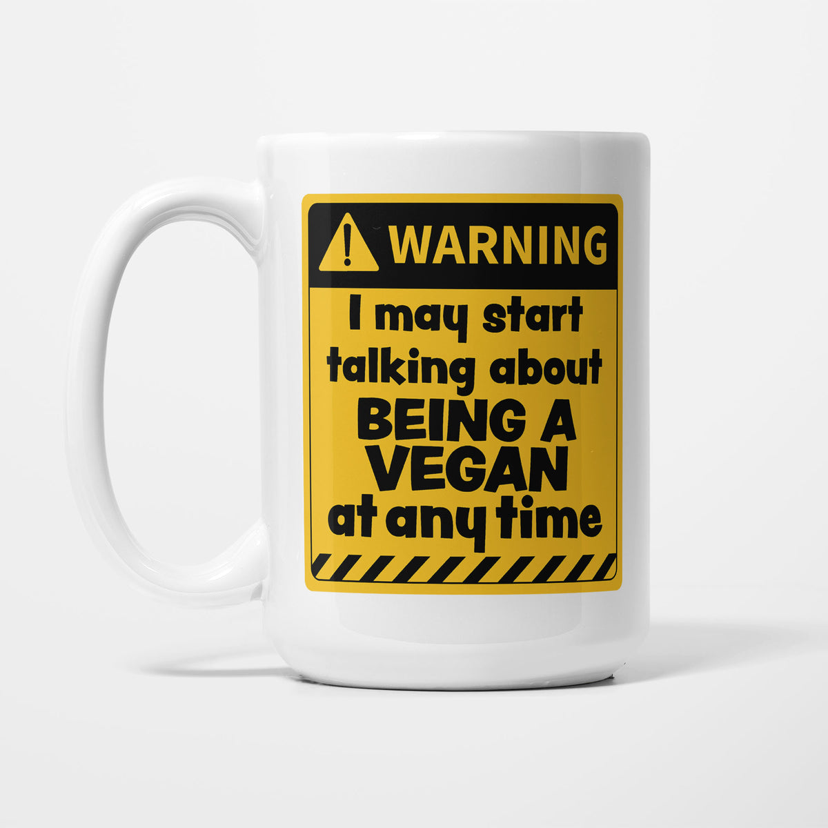 The 15oz Warning mug, white ceramic with a yellow and black warning sign reading 'I may start talking about Being a Vegan at any time'