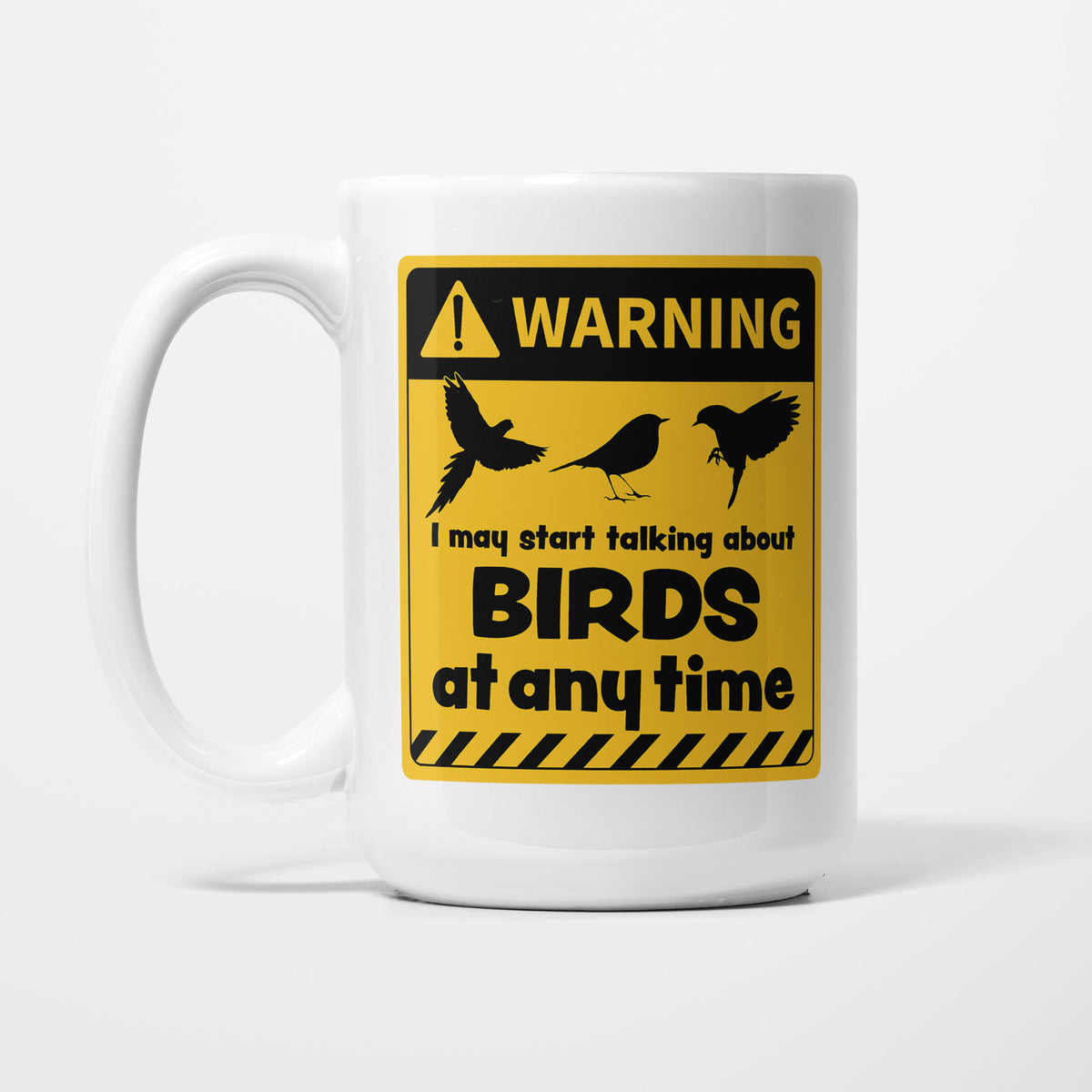The 15oz Warning mug, white ceramic with a yellow and black warning sign showing three bird silhouettes above 'I may start talking about Birds at any time'