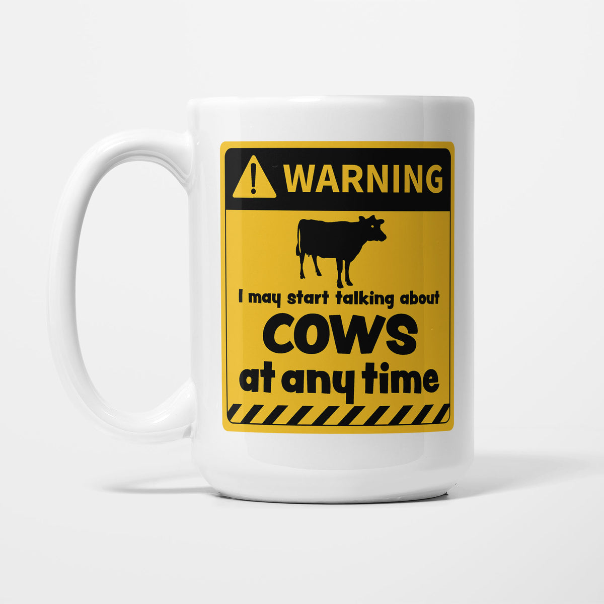 The 15oz Warning mug, white ceramic with a yellow and black warning sign showing a cow silhouette above 'I may start talking about Cows at any time'