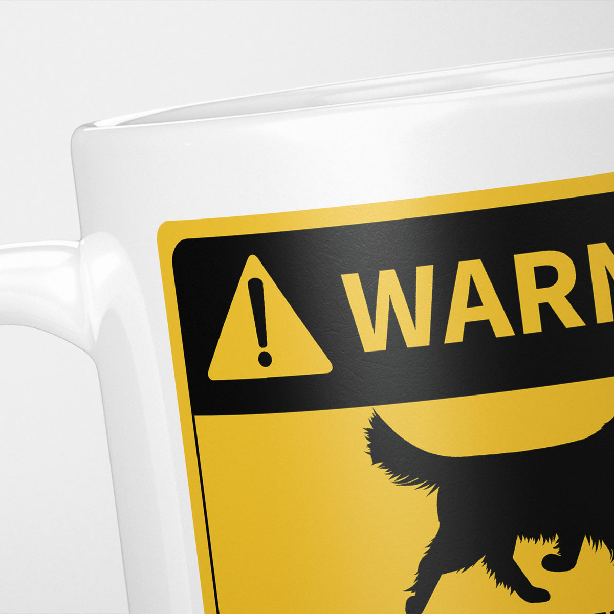Close crop of the Dogs warning sign, the hazard triangle and 'warning' above a dog silhouette