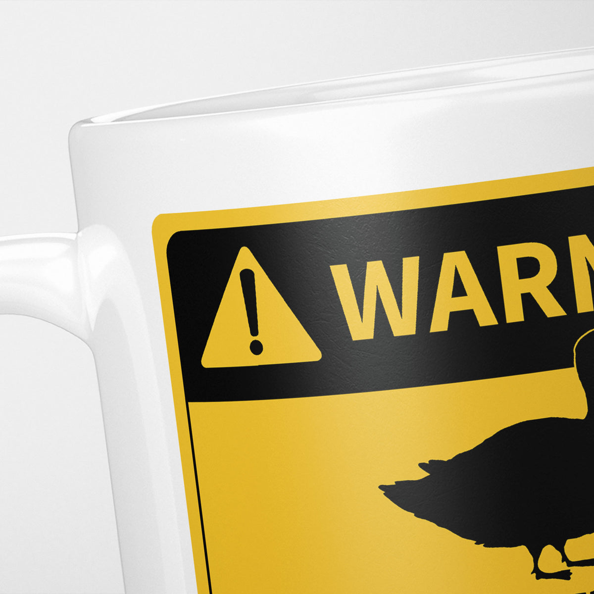 Close crop of the Ducks warning sign, the hazard triangle and 'warning' above a duck silhouette