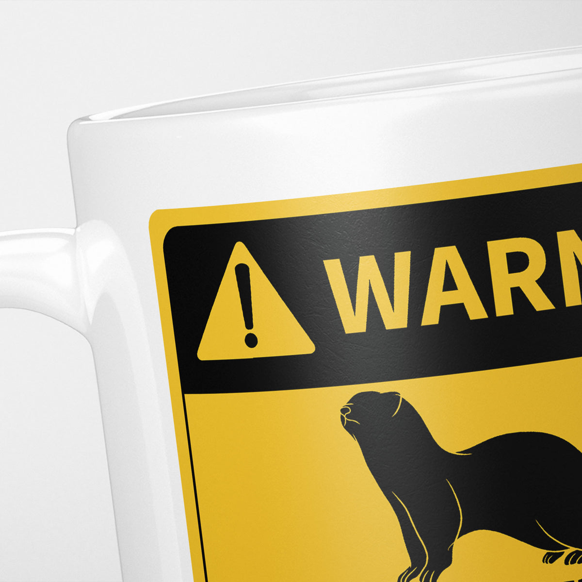 Close crop of the Ferrets warning sign, the hazard triangle and 'warning' above a ferret silhouette